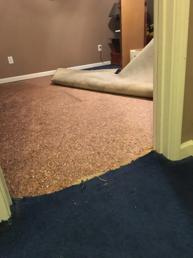 Carpet pad removal revealing water damage during Water Mitigation Services in Nanakuli
